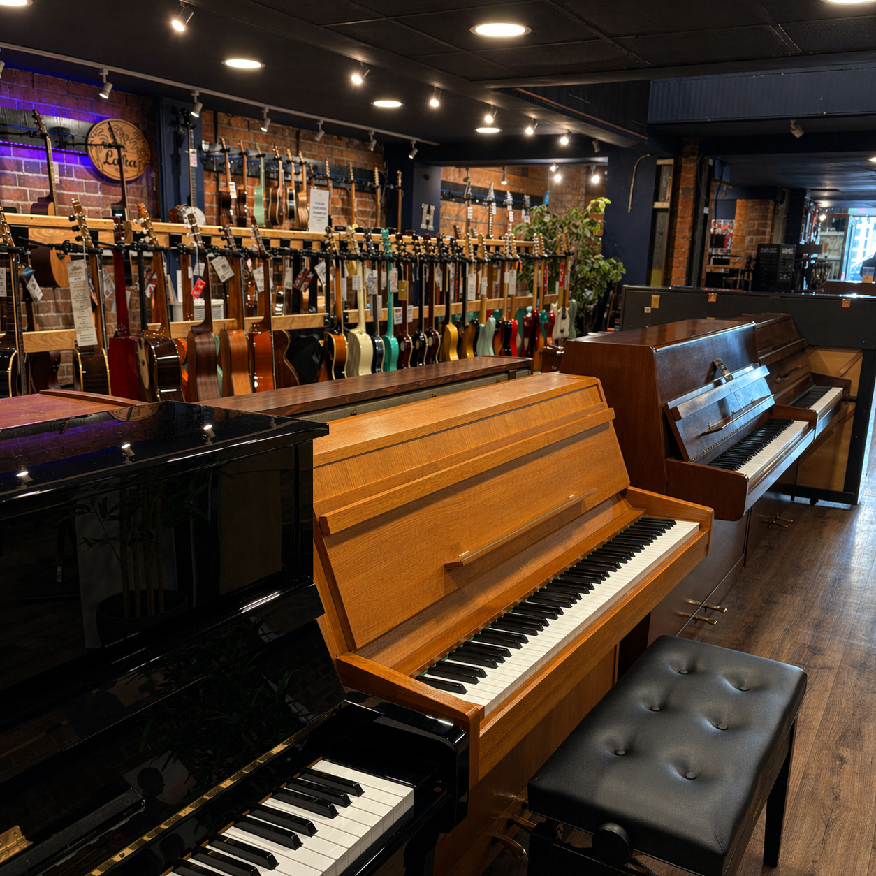 Student practising on an acoustic piano in the Hickies gallery