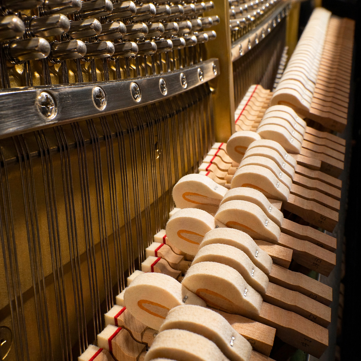 Customers trying acoustic pianos in the Hickies piano gallery